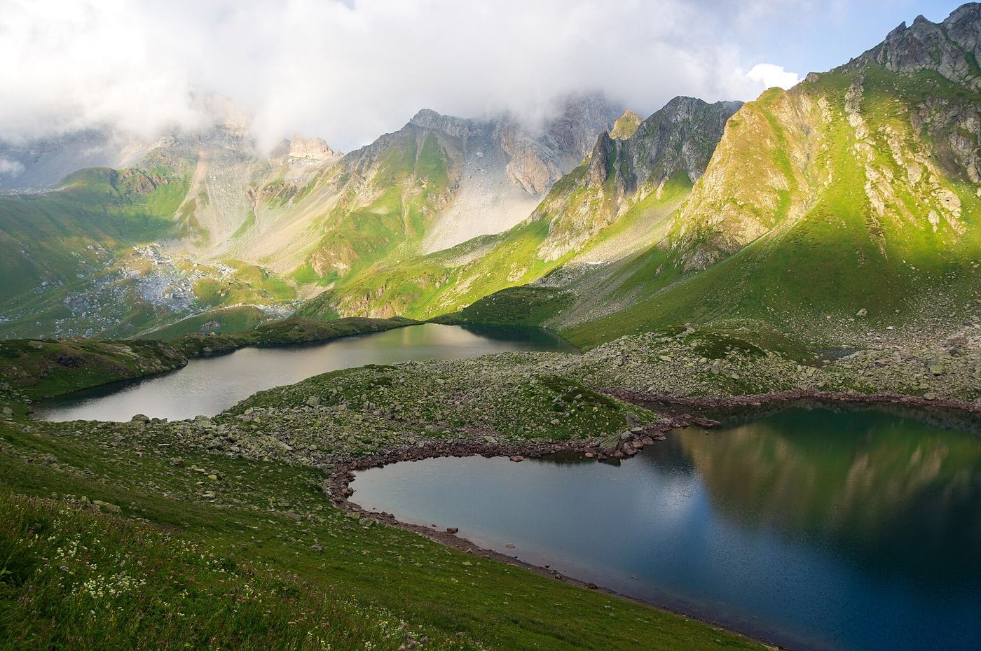 mountain valley with a glacial lake where ice has recently retreated