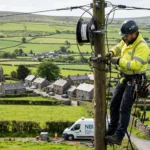 An engineer installing fibre broadband in the rural Irish countryside